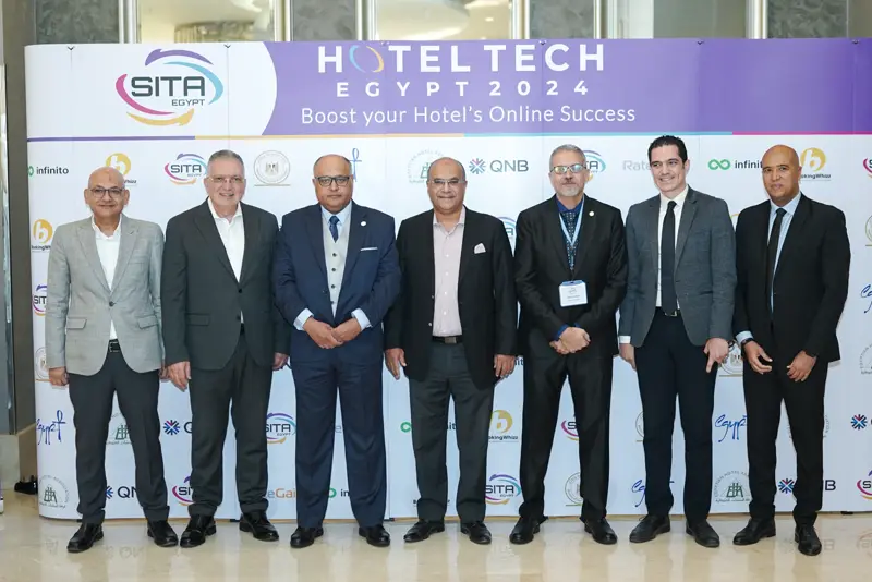 Guests at the Hotel Tech 2024 backdrop
